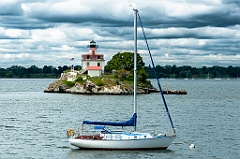 Sailboat Moored in Front of Pomham Rocks Light in Rhode Island